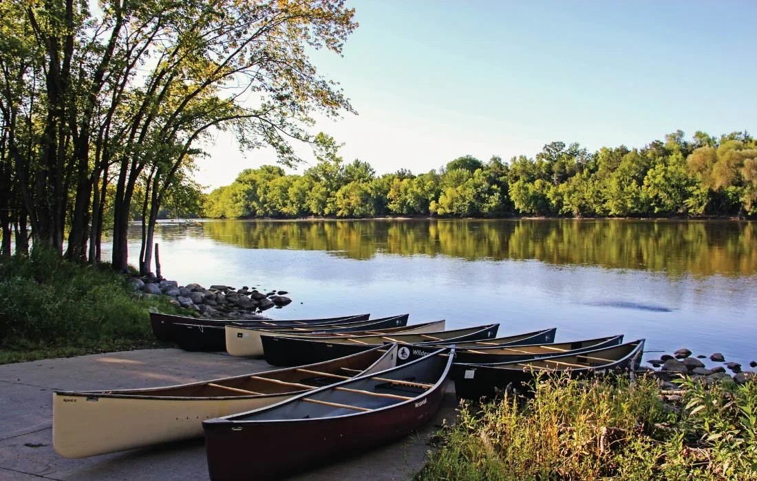 Canoes at the rivershore of Mississippi West Regional Park.